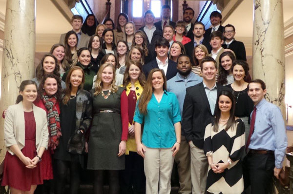 D.P.T. students take a break on the stairs at the state capitol.