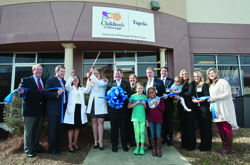Julie Sparks, nurse coordinator at Children’s of Mississippi’s new Tupelo specialty clinic, leads a tour during the clinic’s January 21, 2015, opening and ribbon-cutting.  It joins other pediatric specialty clinics across the state, including a Gulf Coast clinic that’s a partnership with Memorial Hospital.