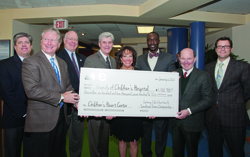 Sharing in the presentation of a $1.1 million check (from left) Steve Jent, tournament director of the Sanderson Farms Championship golf tournament; Johnny Lang, president of tournament host Century Club Charities, former UMMC Vice Chancellor for Health Affairs and School of Medicine Dean Dr. James Keeton; Gov. Phil Bryant; Friends board chair Sara Ray; Jackson Mayor Tony Yarber; Sanderson Farms CEO Joe F. Sanderson, Jr.; and Friends president Rob Armour.