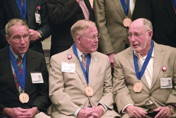 1964 classmates, from left, Dr. A. Jerald Jackson of Hattiesburg, Dr. Edward Hill of Tupelo and Dr. Charles Aaron Hollingshead of Ellisville prepare to sit for a group portrait in the Old Capitol Museum.