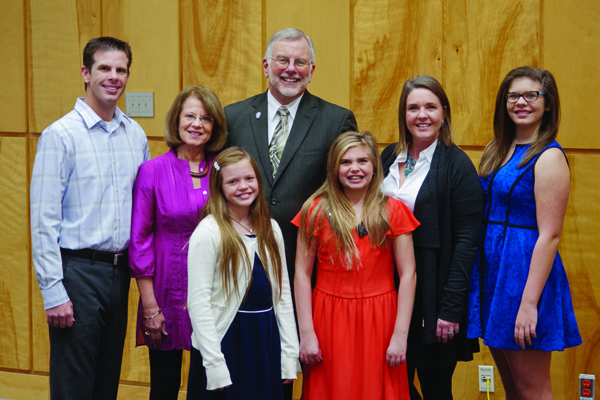 Dr. Steve Case, back row, center, is surrounded by his family during a reception at UMMC honoring his years of service. With him are, back row, from left, his son Chad Erik Case, wife Gay Lynn Case, daughter-in-law Mary Margaret Case and granddaughter Catherine Bryan “Kitty” Case; front row, from left: granddaughters Audrey Davis “Dee” Case and Mary McLauren “Macky” Case.