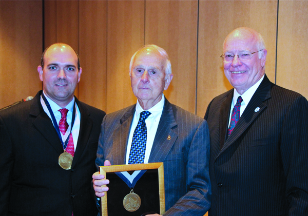 Dr. Charles R. Pound, left, UMMC professor of urology, division chief of urology and program director, is the recipient of the W. Lamar Weems Professorship, named in honor of Dr. Lamar Weems, center, professor emeritus in the UMMC Department of Surgery and a legend in the practice of urology in Mississippi. Dr. James Keeton, right, UMMC vice chancellor for health affairs and dean of the School of Medicine, presided over the ceremony recognizing them both, Sept. 8, at the Country Club of Jackson.