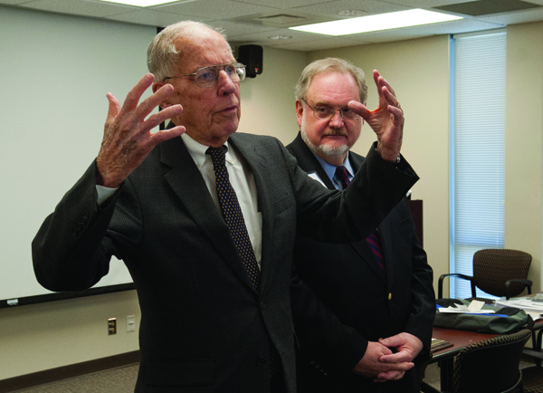 Former Gov. William Winter gives his account of the residents’ uprising to an attentive Dr. Pat Barrett.