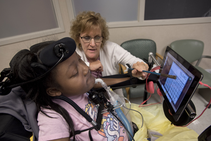 Kathy Doonan helps DeAsia Scott of Jackson with a math lesson.