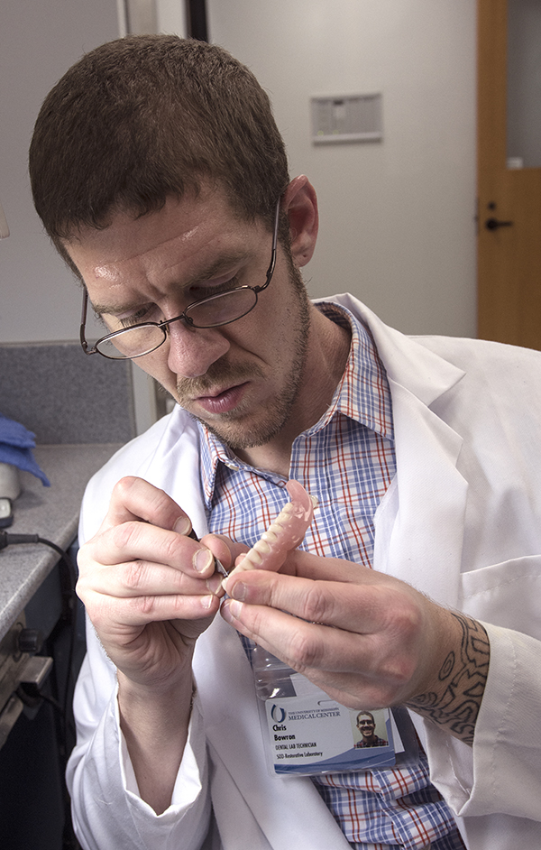 Bowron crafts a dental prostheses.