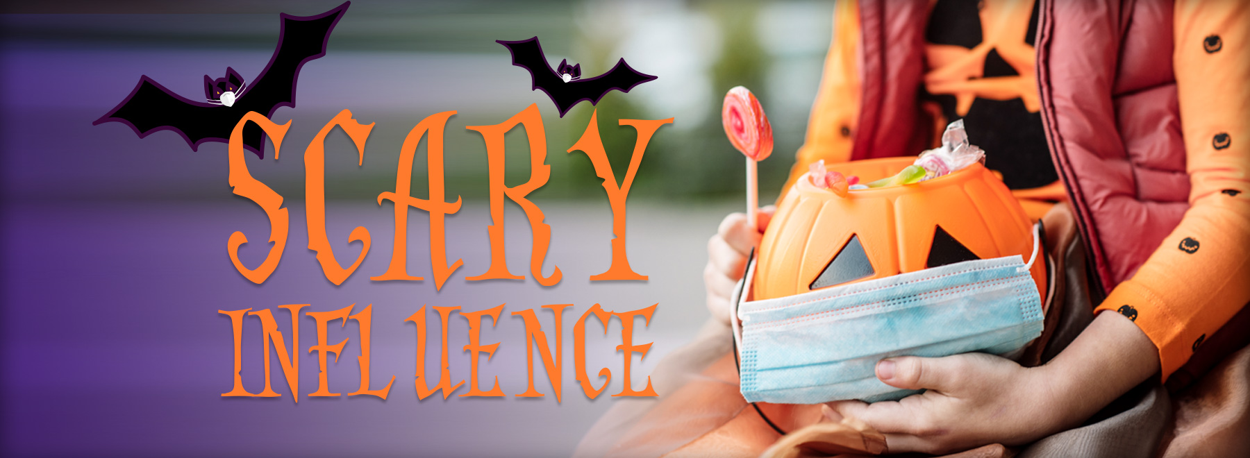 Child holding a Jack-O-Lantern candy bowl with a mask covering its face.