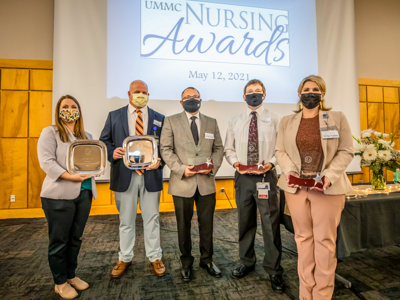 UMMC Hall of Fame and All-Star Award winners are, from left, Mary Manuel, director of operations for the Department of Preventive Medicine, accepting on behalf of Hall of Fame winner Dr. Josie Bidwell, a nurse practitioner and clinical director of the Department of Preventive Medicine; Hall of Fame winner Dr. Brad Martin, an orthopedic surgery nurse practitioner in the Department of Orthopaedics; All-Star winner Joe Easterling, a registered nurse in the Adult Emergency Department; All-Star winner Bradley Vanlandingham, a registered nurse in the Pediatric Emergency Department; and All-Star winner Dr. Jamie Thompson, a registered nurse and director of perioperative finances and business operations.