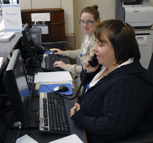 Michelle Hamilton (on phone) and Sue Rankin, on-site concierge