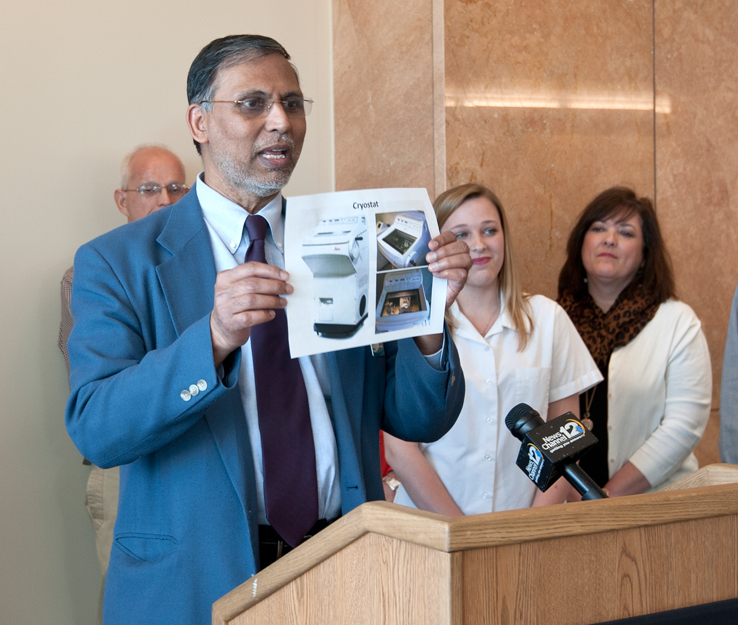 Dr. Srinivasan Vijayakumar, Cancer Institute director, displays the Cryostat machine the donated funds will purchase.