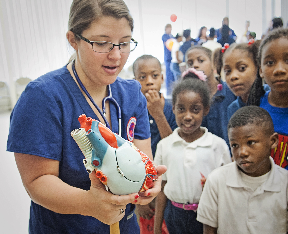 Senior nursing student Jenna Tinnerello describes the functions of the heart to the third-grade class at Brown Elementary.