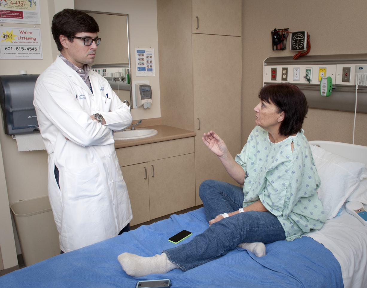 University of Mississippi Medical Center assistant professor of surgery Dr. Mark Earl explains to Jackson resident and diabetic Nancy Smith how he will transplant into her abdomen a donated pancreas.