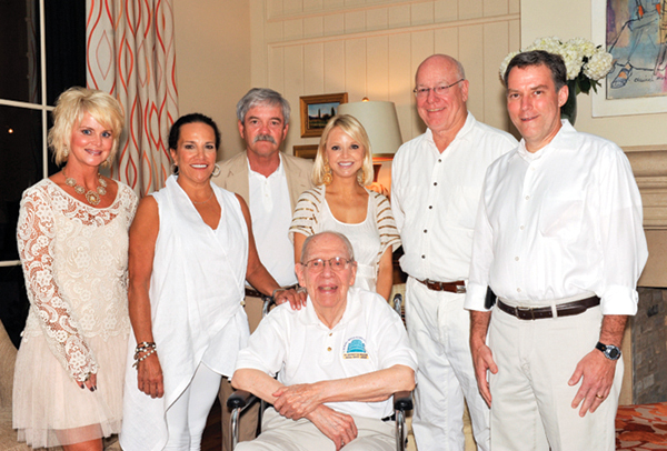 Dr. Blair E. Batson, front, UMMC’s first chair of pediatrics, enjoys the 2012 BankPlus  Presents Enchanted Evening with, from left, Friends board member Cathy Havens, Friends board chair Sara Ray, Evans, Friends board member Leigh Reeves, Dr. James E. Keeton, former vice chancellor for health affairs and Dr. Rick Barr, chair of pediatrics.