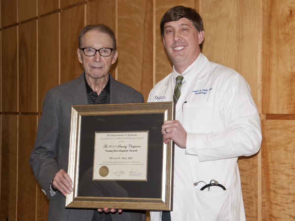Dr. Stanley Chapman, left, professor emeritus of infectious diseases at UMMC, poses with Dr. Michael Hall, the first recipient of the Stanley Chapman Young Investigator Award during the 2015 Department of Medicine Research Day event.