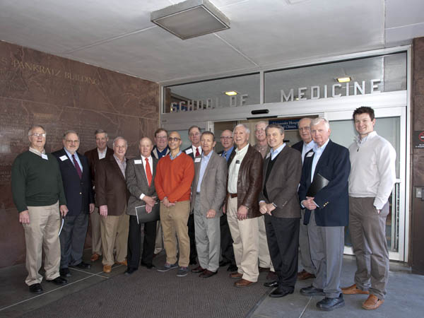 During a tour of the campus, reunion attendees stopped by the School of Medicine. (A larger version of this photo, including the names of those pictured, is available below this article.)