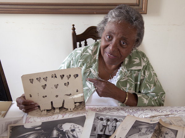 Ruby Winters, a suture nurse on the heart transplant team at UMMC in 1964, displays a photo of her 1949 nursing school graduating class.