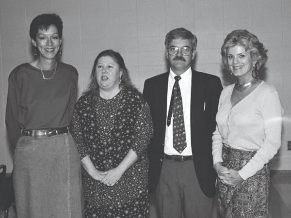 Friends board members, from left, Lynn Kriss and Brenda Smith attend a Friends annual meeting with Evans and Thames.