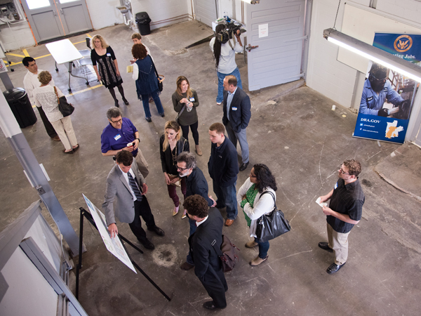 Visitors tour the future location of the Up in Farms Food Hub.