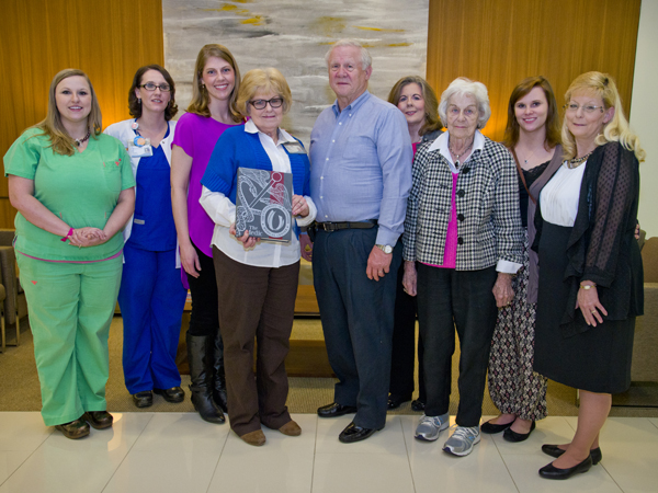 Virginia Covington, center, was honored in early 2014, when the 2013 edition of the annual student yearbook, The Medic, was dedicated to her by the Associated Student Body. Many of her family members were on hand to congratulate her.