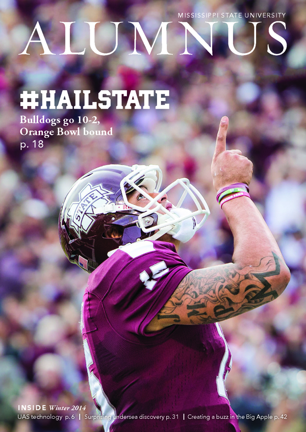 The winter 2014 cover of Alumnus magazine features Dr. Mark Reed's photo of Mississippi State University quarterback Dak Prescott.