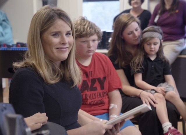 Jenna Bush Hager reads from the book, "Read All About It!," that she authored with her mother, former first lady Laura Bush. At her side is Nicholas Page of Little Rock, Arkansas.