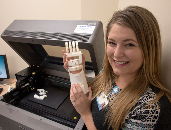 Sarah Bond, an OT student, worked with Robin Parish, an assistant professor of OT, to produce this 3-D pattern for a prosthetic hand.