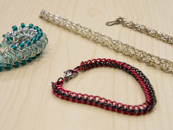 Tiny metal links are intertwined to create chainmaille jewelry.