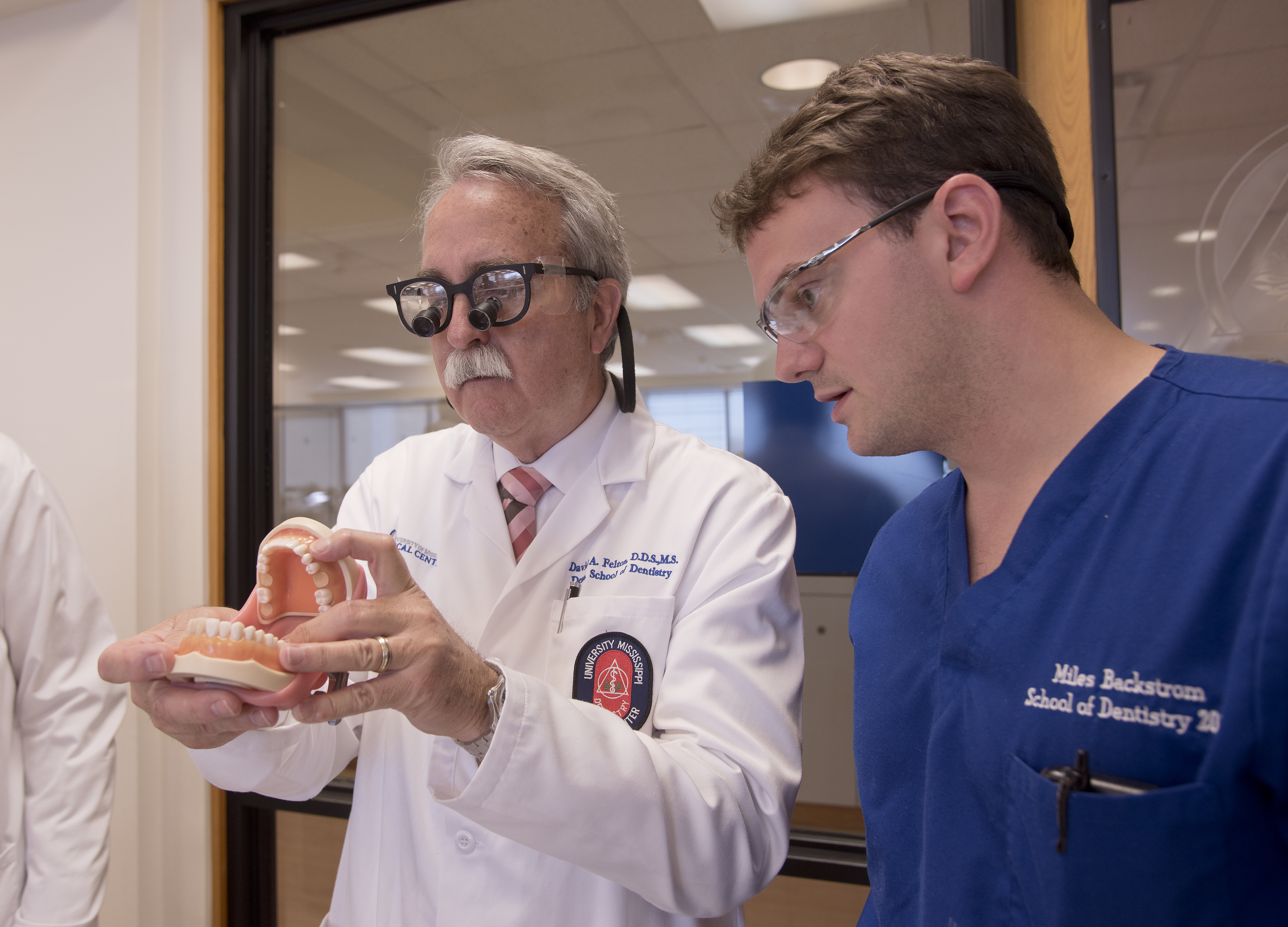 Felton instructs D2 Miles Backstrom during a fixed prosthodontics pre-clinical class.