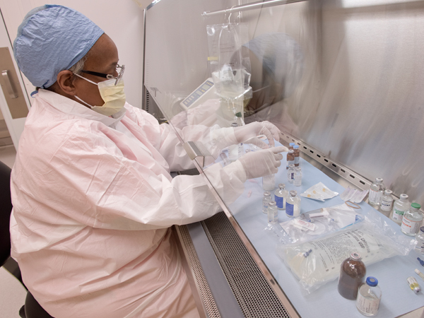 Pharmacy technician Sharon Henderson uses the current clean room at UMMC to mix life-saving drugs.