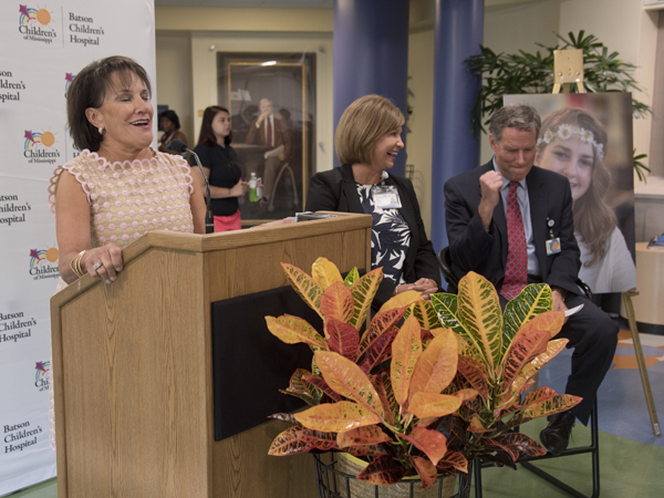 Dr. Rick Barr, Suzan B. Thames Professor and chair of pediatrics, pumps his fist after hearing Ray announce the Friends gift.