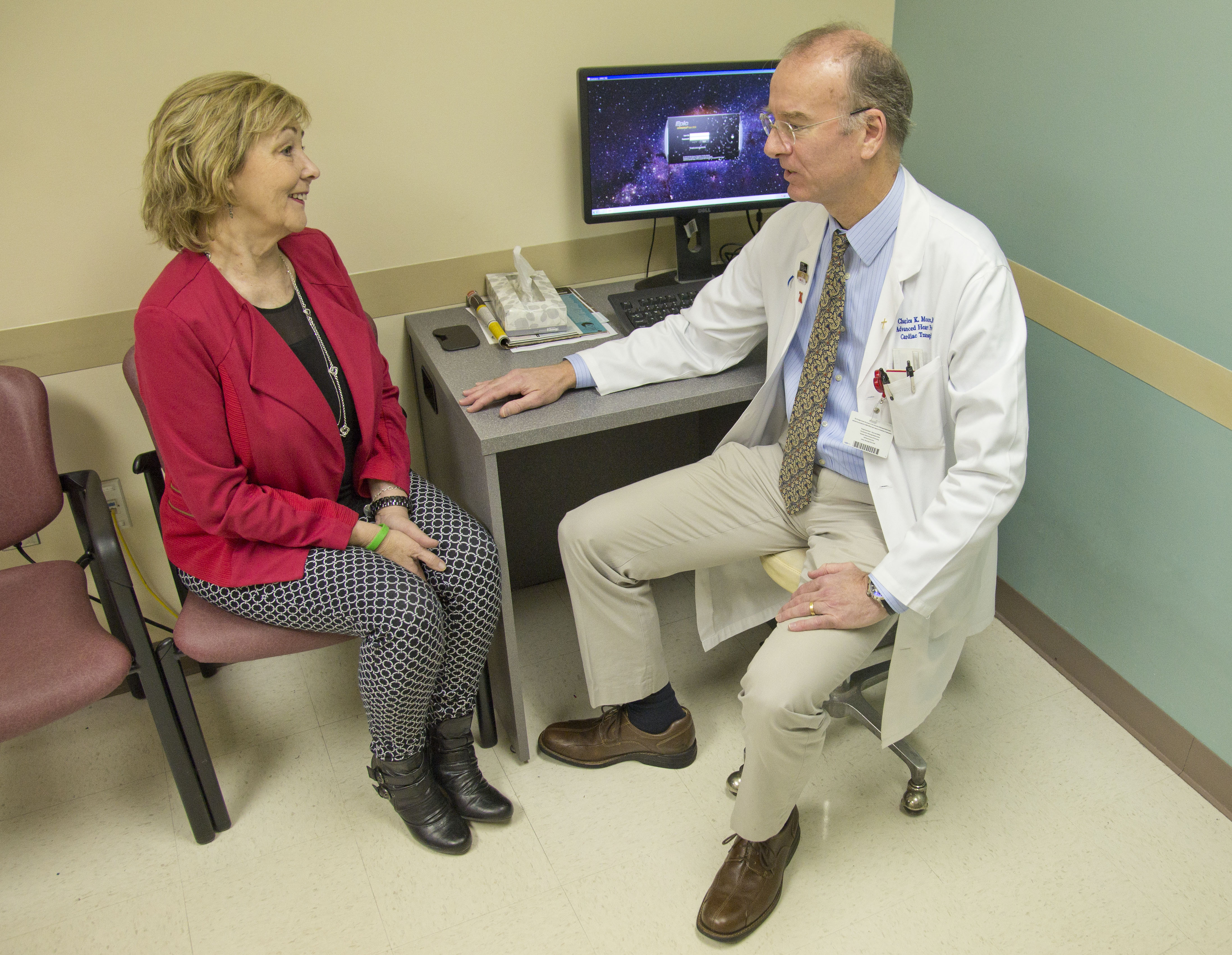 Moore visits with heart transplant recipient Gordon during a recent checkup. Gordon received the first heart transplant of 2016.