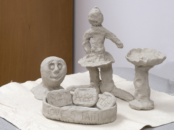 Clay sculpture created by one patient features literal expressions of emotions -- including "anger" and "fear."