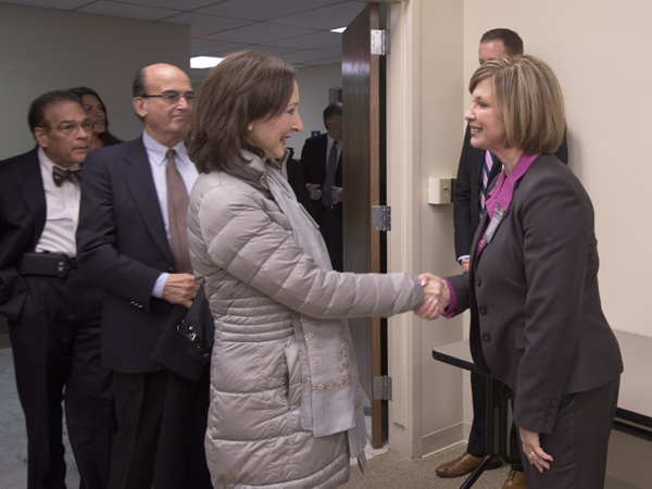 Woodward greets Gloria Bellelli, consul general for Italy in Miami.