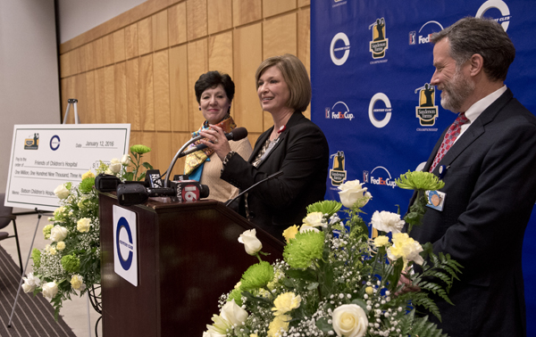 Dr. LouAnn Woodward, UMMC vice chancellor for health affairs and dean of the School of Medicine, thanks Century Club Charities and Sanderson Farms for a $1.109 million gift to Friends of Children's Hospital. Looking on are Dr. Renate Savich, professor of pediatrics and chief of the Division of Newborn Medicine, and Dr. Rick Barr, Suzan B. Thames Professor and Chair of Pediatrics.