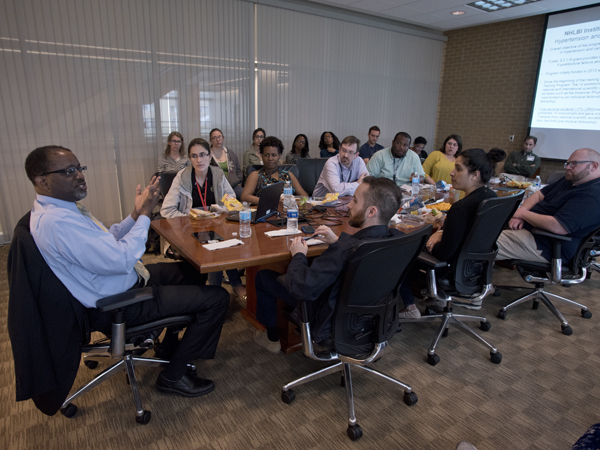 Dr. Gibbons takes a question from Dr. Frank Spradley (front right), instructor of surgery, during a session with UMMC trainees.