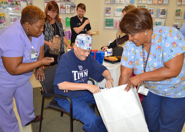 Kim Cain, oncology nurse, left, and Janice Johnson, Cancer Institute Patient Resource Center manager, help pack the Universal Studio props for Mellon to share with his nieces and nephews.