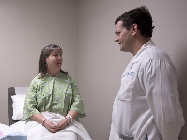 Orr, right, talks with Stegall during her visit to UMMC's Melanoma Clinic.