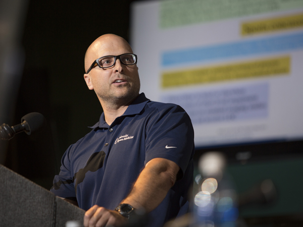 Tollefson tells coaches and trainers at the forum how to identify concussions on the sidelines.