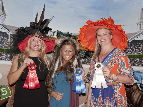 Winners in the University Transplant Guild's "Day at the Derby" fundraiser hat competition are, from left, Valerie Brunt, second place; Liz Ethridge, first place; and Theresa Anderson, third place.