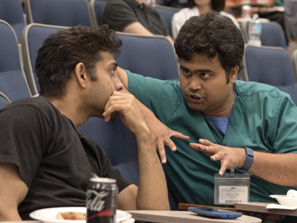 Vallabhaneni, right, describes X-rays to his seminar partner.