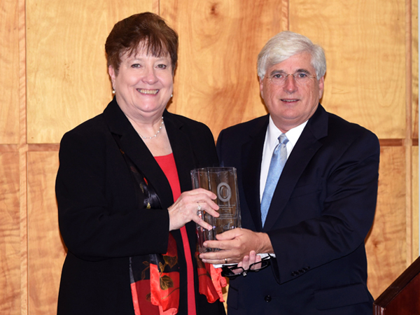 Granger, right, presents Bender with the award.
