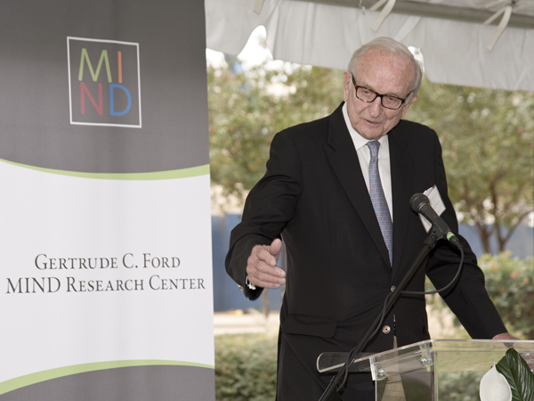 Ambassador John Palmer speaks on behalf of the MIND Center advisory board.