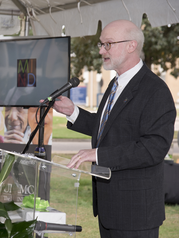 Dr. Tom Mosley, director of the MIND Center, speaks at the announcement ceremony.