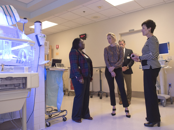 Dr. Mobolaji Famuyide, left, Dr. Rick Barr and Dr. Renate Savich tell comedian and author Ali Wentworth, center, about the neonatal intensive care unit at Wiser Hospital for Women and Infants.