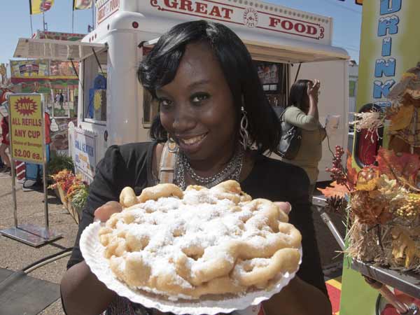 Latasha McGee of Pearl plans to share her funnel cake with a friend.