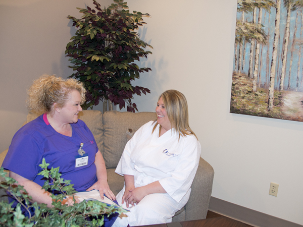McCammon, left, helps patient Self relax in the Imaging Center's private waiting area for those getting a mammogram.