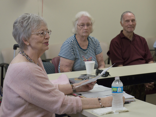 Schott leads the support group as members Jerry and Lewis Jones of Lena listen.