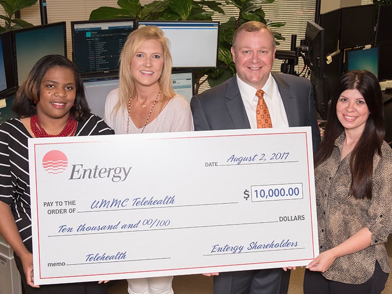 Taking part in a check presentation for Entergy’s $10,000 donation to the Center for Telehealth at the University of Mississippi Medical Center are Durant native Tearsanee Davis, the Center’s director of clinical and advanced practice operations; Entergy representative Valarie Mabry; UMMC Center for Telehealth executive director Michael Adcock; and Tara Craft, Center for Telehealth services administrator.
