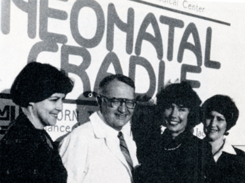 On hand for the Neonatal Cradle's christening party in 1979 were Dr. Norman C. Nelson, UMMC vice chancellor for health affairs and Junior League of Jackson members, from left, Helen Dalehite, Alabel Liles and Judy Porter.