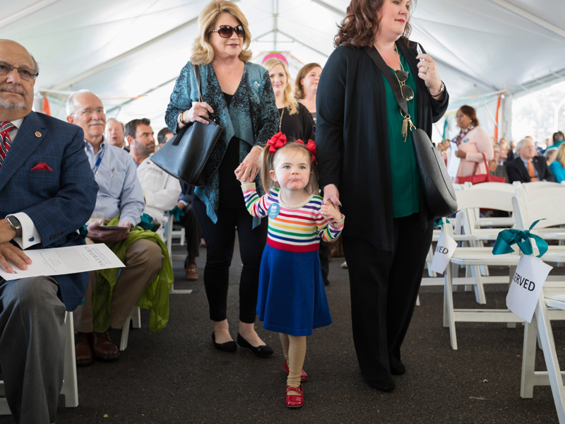 Batson Children's Hospital patient Addison Hamm and family members take a seat at the groundbreaking ceremony.