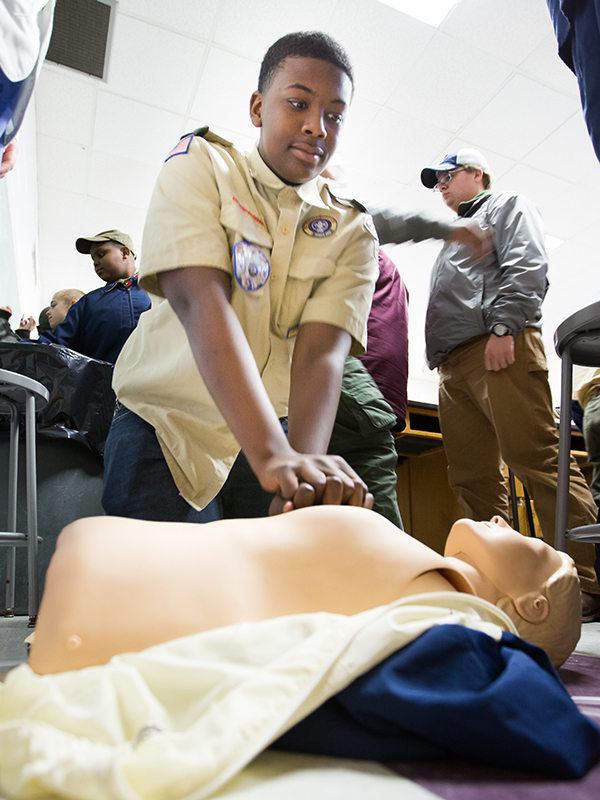 Boy Scout Jarred Caston, 13, of Jackson tries his hands at chest compressions.